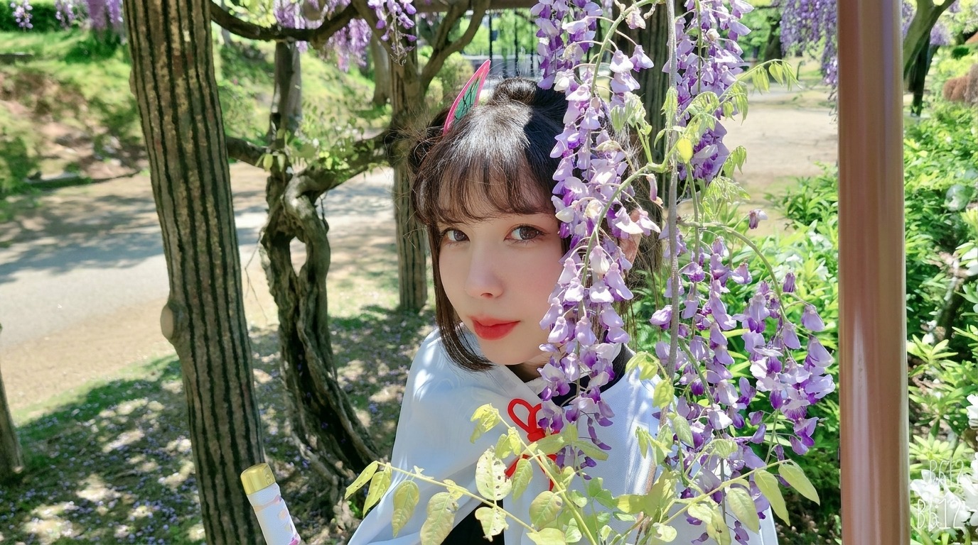cinnamohime in a Kanao cosplay under wisteria